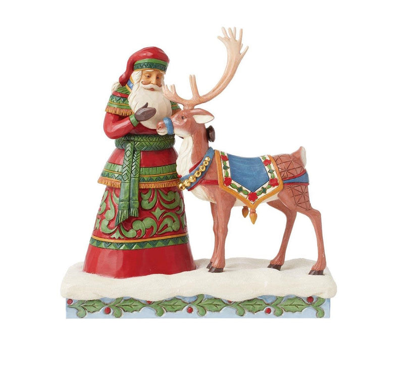 Santa Standing with a Reindeer Figurine